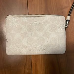 Used once. Snowflake Coach wallet.